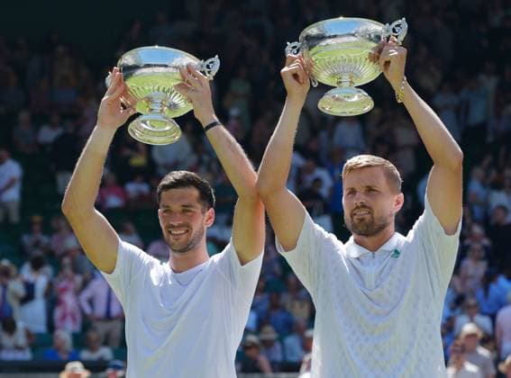 Tennis - 2025 Wimbledon Championships - Mens Doubles Final - Winky Hijikata and David Pel v Julian Cash and Lloyd Glasspool All England Lawn Tennis & Croquet Club - Saturday 12th July 2025 Julian Cash and Lloyd Glasspool with their winners trophies 