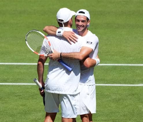 Tennis - 2025 Wimbledon Championships - Mens Doubles Final - Winky Hijikata and David Pel v Julian Cash and Lloyd Glasspool All England Lawn Tennis & Croquet Club - Saturday 12th July 2025 Julian Cash and Lloyd Glasspool celebrate winning match point 