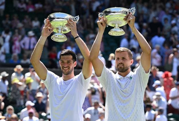 (250712) -- LONDON, July 12, 2025 -- Julian Cash (L) Lloyd Glasspool pose with their trophies during the awarding ceremony after the men s doubles final between Rinky Hijikata (Australia) David Pel (the Netherlands) and Julian Cash Lloyd Glasspool of Britain at the Wimbledon Tennis Championships in London, Britain, July 12, 2025. ) (SP)BRITAIN-LONDON-TENNIS-WIMBLEDON-MEN S DOUBLES-FINAL ZhaoxDingzhe 
