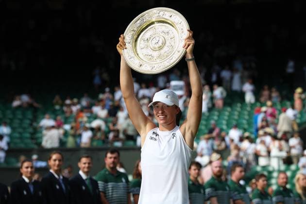 12th July 2025; All England Lawn Tennis and Croquet Club, London, England; Wimbledon Tennis Tournament, Day 13; Iga Swiatek (POL) lifts the Ladies Singles Trophy after defeating Amanda Anisimova (USA) by 6-0 6-0  ActionPlus12812791 JohnxPatrickxFletcher