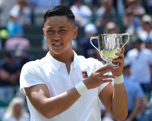Tennis - 2025 Wimbledon Championships - Mens singles Wheelchair Final - Alfie Hewitt (GBR) v Tokito Oda (Japan) All England Lawn Tennis & Croquet Club - Sunday 13th July 2025 Tokito Oda (Japan) with the trophy 