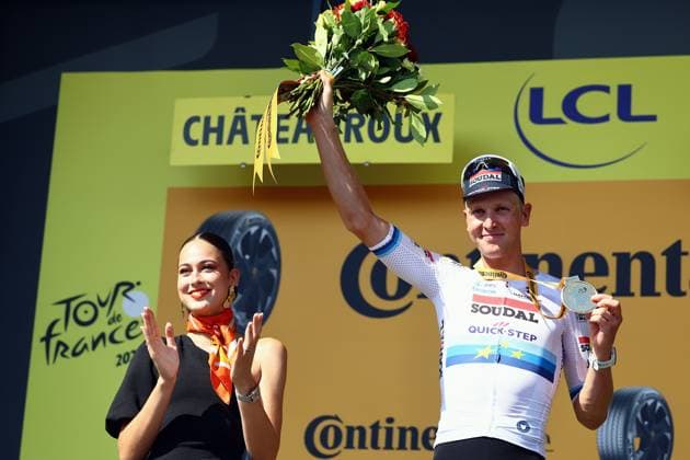 Belgian Tim Merlier of Soudal Quick-Step celebrates on the podium after winning stage nine of the 2025 Tour de France cycling, from Chinon to Chateauroux (170 km), on Sunday 13 July 2025 in France. The 112th edition of the Tour de France starts on Saturday 5 July in Lille, France, and will finish in Paris, France on the 27th of July. DAVIDxPINTENS  x129084975x