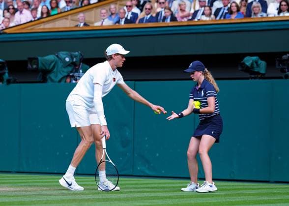 Jannik Sinner hands a champagne cork to a ball girl during the Gentlemen s Singles final Wimbledon Tennis Championships, Day 14, The All England Lawn Tennis and Croquet Club, London, UK - 13 Jul 2025London The All England Lawn Tennis and United Kingdom  Copyright: xJavierxGarcia Shutterstockx 15392297ec