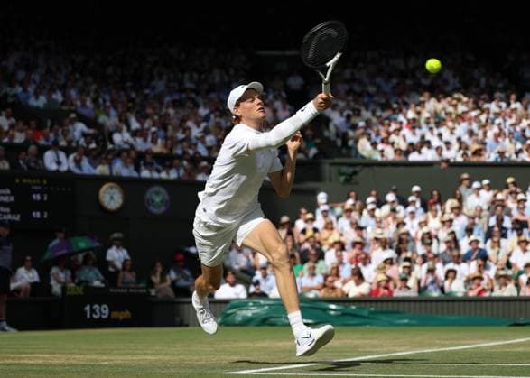 13th July 2025; All England Lawn Tennis and Croquet Club, London, England; Wimbledon Tennis Tournament, Day 14; Jannik Sinner (ITA) with a forehand shot to Carlos Alcaraz (ESP) , mens singles final match  ActionPlus12813414 JohnxPatrickxFletcher