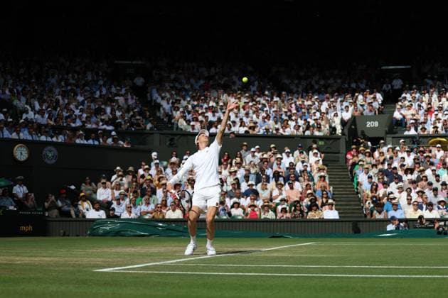 13th July 2025; All England Lawn Tennis and Croquet Club, London, England; Wimbledon Tennis Tournament, Day 14; Jannik Sinner (ITA) serves to Carlos Alcaraz (ESP) , mens singles final match  ActionPlus12813416 JohnxPatrickxFletcher
