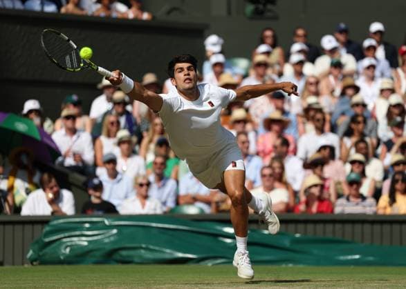 13th July 2025; All England Lawn Tennis and Croquet Club, London, England; Wimbledon Tennis Tournament, Day 14; Carlos Alcaraz (ESP) with a forehand shot to Jannik Sinner (ITA) in the mens singles final  ActionPlus12813419 JohnxPatrickxFletcher