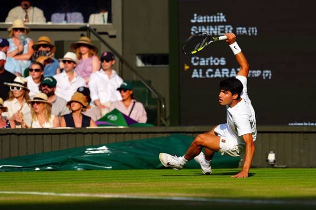 Carlos Alcaraz falls as his serve is broken during the Gentlemen s Singles final Wimbledon Tennis Championships, Day 14, The All England Lawn Tennis and Croquet Club, London, UK - 13 Jul 2025London The All England Lawn Tennis and United Kingdom  Copyright: xJavierxGarcia Shutterstockx 15392297fu