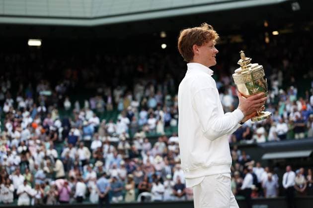 Jannik Sinner holds aloft the Gentlemen s Singles trophy Wimbledon Tennis Championships, Day 14, The All England Lawn Tennis and Croquet Club, London, UK - 13 Jul 2025London The All England Lawn Tennis and United Kingdom  Copyright: xEllaxLing Shutterstockx 15392298db