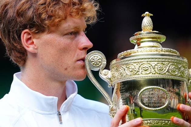 Jannik Sinner holds aloft the Gentlemen s Singles trophy Wimbledon Tennis Championships, Day 14, The All England Lawn Tennis and Croquet Club, London, UK - 13 Jul 2025London The All England Lawn Tennis and United Kingdom  Copyright: xJavierxGarcia Shutterstockx 15392297gy