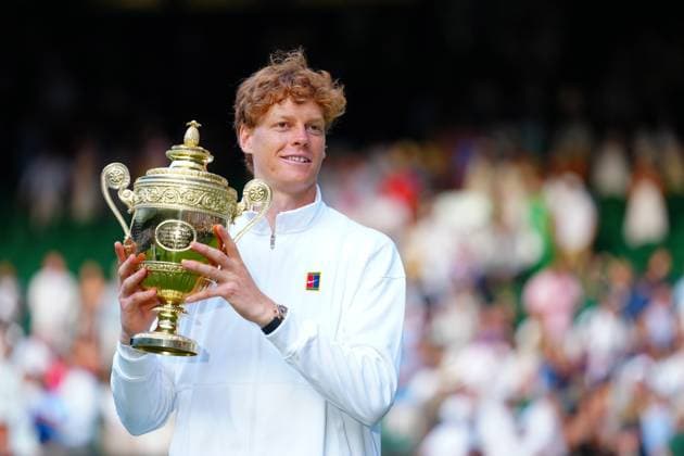 Jannik Sinner holds aloft the Gentlemen s Singles trophy Wimbledon Tennis Championships, Day 14, The All England Lawn Tennis and Croquet Club, London, UK - 13 Jul 2025London The All England Lawn Tennis and United Kingdom  Copyright: xJavierxGarcia Shutterstockx 15392297hg