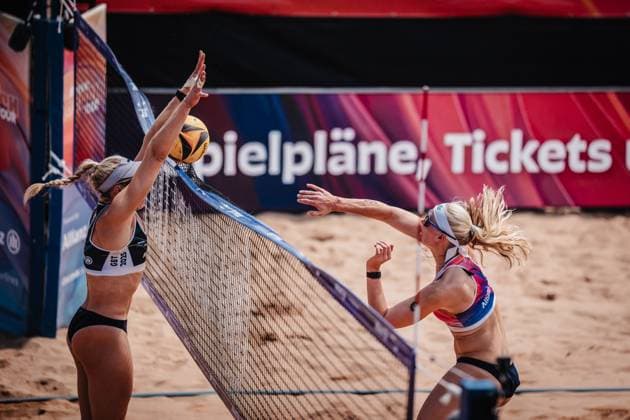 Beach volleyball women Allianz German Beach Tour 2025 Tourstop Munich 13 07 2025 right Anna Behlen attacking left Melanie Paul Munich Central University Sports Munich Bavaria Germany