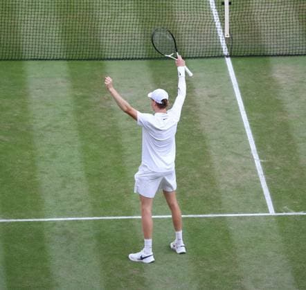 Italian Jannik Sinner celebrates victory in the Men s Wimbledon singles after defeating Spain s Carlos Alcaraz on day fourteen of the 2025 Wimbledon Championships in London on Sunday, July 13, 2025. Sinner won 4-6,6-4,6-4,6-4.  LON2025071392 HUGOxPHILPOTT