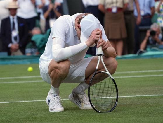Tennis - 2025 Wimbledon Championships - Mens singles Final - Jannik Sinner (Italy) v Carlos Alcaraz (Spain) All England Lawn Tennis & Croquet Club - Sunday 13th July 2025 Jannik Sinner (Italy) drops to his knees after winning the match 