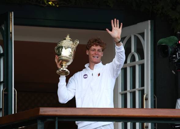 13th July 2025; All England Lawn Tennis and Croquet Club, London, England; Wimbledon Tennis Tournament, Day 14; Jannik Sinner (ITA) lifts the Gentlemen& x2019;s Single Trophy on the Centre Court balcony in front of the crowd after defeating Carlos Alcaraz (ESP) by 4-6 6-4 6-4 6-4 to become the 2025 Wimbledon Gentlemen& x2019;s Singles Champion  ActionPlus12813459 JohnxPatrickxFletcher