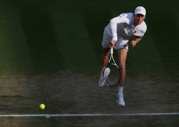 Italian Jannik Sinner serves during the Wimbledon Men s Singles Final against Spain s Carlos Alcaraz on day fourteen of the 2025 Wimbledon Championships in London on Sunday, July 13, 2025.  LON20250713101 HUGOxPHILPOTT