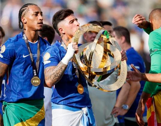 Chelsea FC v Paris Saint-Germain: Final - FIFA Club World Cup 2025 Joao Pedro and Enzo Fernandez of Chelsea celebrate with the FIFA Club World Cup Trophy after winning the FIFA Club World Cup 2025 final match between Chelsea FC and Paris Saint-Germain at MetLife Stadium on July 13, 2025 in East Rutherford, United States. East Rutherford MetLife Stadium NJ United States Copyright: xRichardxSellers Sportsphoto APLx 14130936