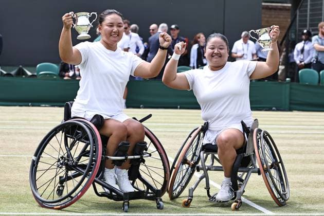 Li Xiaohui and Wang Ziying, CHN, after wheelchair doubles final at 2025 All England Lawn Tennis Championships in Wimbledon, London, 13 07 2025