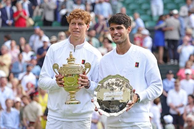Jannik Sinner, ITA, and Carlos Alcaraz, ESP, after final of 2025 All England Lawn Tennis Championships at Wimbledon, mens singles, London, 13 07 2025