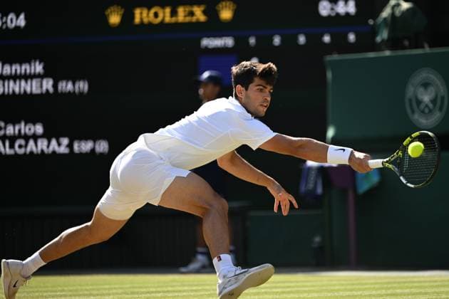 (250714) -- LONDON, July 14, 2025 -- Carlos Alcaraz hits a return during the men s singles final between Carlos Alcaraz of Spain and Jannik Sinner of Italy at the Wimbledon Tennis Championships in London, Britain, July 13, 2025. ) (SP)BRITAIN-LONDON-TENNIS-WIMBLEDON-MEN S SINGLES-FINAL LixYing 