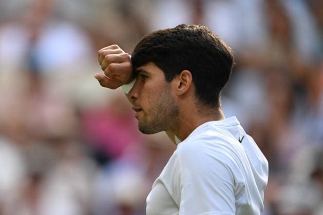 (250714) -- LONDON, July 14, 2025 -- Carlos Alcaraz reacts during the men s singles final between Carlos Alcaraz of Spain and Jannik Sinner of Italy at the Wimbledon Tennis Championships in London, Britain, July 13, 2025. ) (SP)BRITAIN-LONDON-TENNIS-WIMBLEDON-MEN S SINGLES-FINAL LixYing 