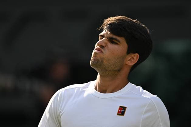 (250714) -- LONDON, July 14, 2025 -- Carlos Alcaraz reacts during the men s singles final between Carlos Alcaraz of Spain and Jannik Sinner of Italy at the Wimbledon Tennis Championships in London, Britain, July 13, 2025. ) (SP)BRITAIN-LONDON-TENNIS-WIMBLEDON-MEN S SINGLES-FINAL LixYing 