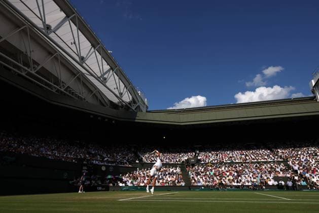 13th July 2025; All England Lawn Tennis and Croquet Club, London, England; Wimbledon Tennis Tournament, Day 14; Carlos Alcaraz (ESP) serves to Jannik Sinner (ITA) during the Gentlemen s singles final match  ActionPlus12813534 JohnxPatrickxFletcher