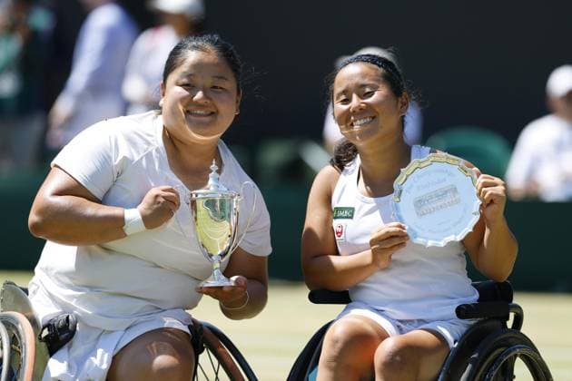 Tennis: Wimbledon championships Wang Ziying (L) of China poses with the trophy after claiming the women s wheelchair singles title at the Wimbledon tennis tournament, alongside runner-up Yui Kamiji of Japan, in London on July 12, 2025.  A14AA0004722241P