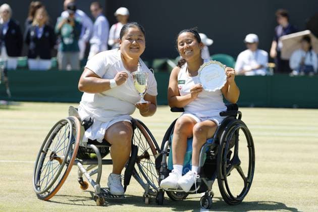 Tennis: Wimbledon championships Wang Ziying (L) of China poses with the trophy after claiming the women s wheelchair singles title at the Wimbledon tennis tournament, alongside runner-up Yui Kamiji of Japan, in London on July 12, 2025.  A14AA0004722243P