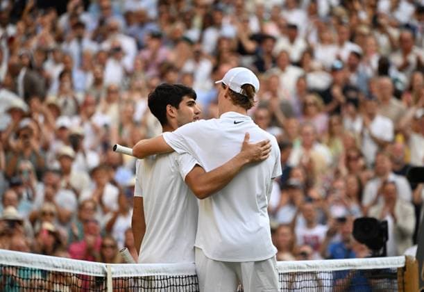 (250714) -- LONDON, July 14, 2025 -- Jannik Sinner (R) greets Carlos Alcaraz after the men s singles final between Carlos Alcaraz of Spain and Jannik Sinner of Italy at the Wimbledon Tennis Championships in London, Britain, July 13, 2025. ) (SP)BRITAIN-LONDON-TENNIS-WIMBLEDON-MEN S SINGLES-FINAL LixYing 
