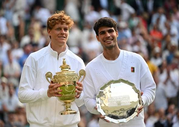 (250714) -- LONDON, July 14, 2025 -- Jannik Sinner (L) and Carlos Alcaraz pose with trophys during the awarding ceremony after the men s singles final between Carlos Alcaraz of Spain and Jannik Sinner of Italy at the Wimbledon Tennis Championships in London, Britain, July 13, 2025. ) (SP)BRITAIN-LONDON-TENNIS-WIMBLEDON-MEN S SINGLES-FINAL LixYing 