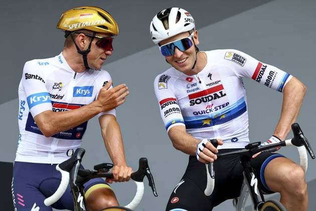 Belgian Remco Evenepoel of Soudal-Quick Step and Belgian Tim Merlier of Soudal-Quick Step pictured at the start of stage 10 of the 2025 Tour de France cycling, from Ennezat to Le Mont-Dore Puy de Sancy (169 km), on Monday 14 July 2025 in France. The 112th edition of the Tour de France starts on Saturday 5 July in Lille, France, and will finish in Paris, France on the 27th of July. DAVIDxPINTENS  x129227198x