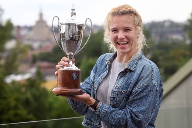 Czech tennis player Katerina Siniakova poses with a trophy after return from Wimbledon, where she won the mixed doubles title, in Prague, Czech Republic, on July 14, 2025. (CTKxPhoto MichaelaxRihova) CTKPhotoP2025071404361  CTKPhotoP2025071404361
