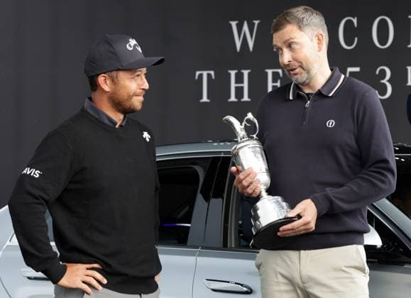 14th July 2025; Royal Portrush Golf Club, Portrush, County Antrim, Northern Ireland; The Open Golf Championship Practice Day 2; 2024 Open Champion Xander Schauffele (USA) returns the Claret Jug trophy to Chief Executive of the R&amp;A Mark Darbon  ActionPlus12813844 DavidxBlunsden