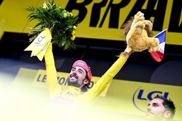Irish Ben Healy of EF Education-EasyPost celebrates on the podium in the yellow jersey of leader in the overall ranking after stage 10 of the 2025 Tour de France cycling, from Ennezat to Le Mont-Dore Puy de Sancy (169 km), on Monday 14 July 2025 in France. The 112th edition of the Tour de France starts on Saturday 5 July in Lille, France, and will finish in Paris, France on the 27th of July. JASPERxJACOBS  x129257161x
