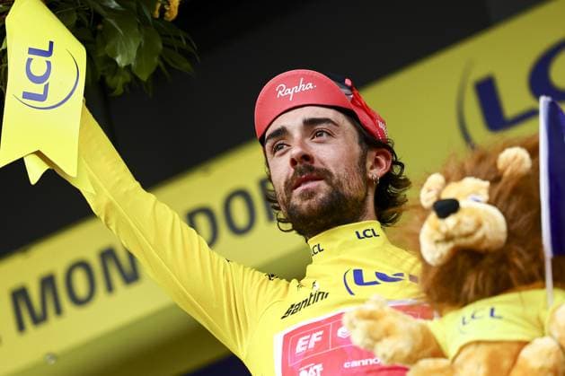 Irish Ben Healy of EF Education-EasyPost celebrates on the podium in the yellow jersey of leader in the overall ranking after stage 10 of the 2025 Tour de France cycling, from Ennezat to Le Mont-Dore Puy de Sancy (169 km), on Monday 14 July 2025 in France. The 112th edition of the Tour de France starts on Saturday 5 July in Lille, France, and will finish in Paris, France on the 27th of July. DAVIDxPINTENS  x129258673x