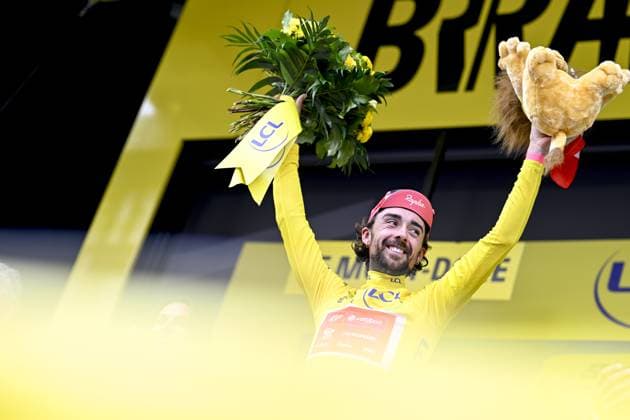 Irish Ben Healy of EF Education-EasyPost celebrates on the podium in the yellow jersey of leader in the overall ranking after stage 10 of the 2025 Tour de France cycling, from Ennezat to Le Mont-Dore Puy de Sancy (169 km), on Monday 14 July 2025 in France. The 112th edition of the Tour de France starts on Saturday 5 July in Lille, France, and will finish in Paris, France on the 27th of July. JASPERxJACOBS  x129258689x