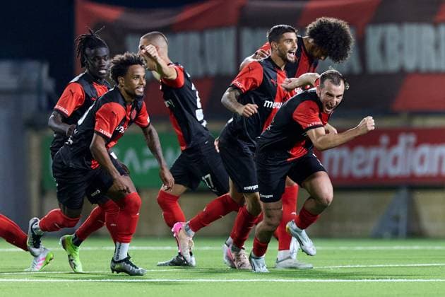 Hamrun Spartans players react in celebration after the decisive penalty scored by Jovan Cadjenovic (not in picture) during the penalty shoot out, after the UEFA Champions League First qualifying round, 2nd leg soccer match between Hamrun Spartans FC and FK Zalgiris at the Centenary Stadium, in Ta Qali, Malta, 15 July 2025. Hamrun Spartans became the first Maltese soccer team to advance to the UEFA Champions League Second qualifying round. UEFA Champions League - Hamrun Spartans FC v FK Zalgiris