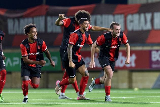 Hamrun Spartans players react in celebration after the decisive penalty scored by Jovan Cadjenovic (not in picture) during the penalty shoot out, after the UEFA Champions League First qualifying round, 2nd leg soccer match between Hamrun Spartans FC and FK Zalgiris at the Centenary Stadium, in Ta Qali, Malta, 15 July 2025. Hamrun Spartans became the first Maltese soccer team to advance to the UEFA Champions League Second qualifying round. UEFA Champions League - Hamrun Spartans FC v FK Zalgiris