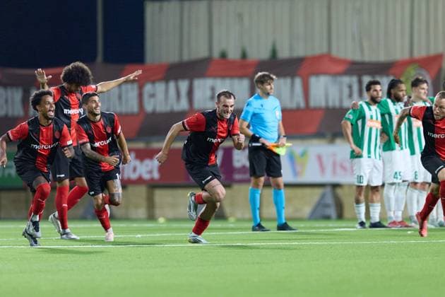 Hamrun Spartans players react in celebration after the decisive penalty scored by Jovan Cadjenovic (not in picture) during the penalty shoot out, after the UEFA Champions League First qualifying round, 2nd leg soccer match between Hamrun Spartans FC and FK Zalgiris at the Centenary Stadium, in Ta Qali, Malta, 15 July 2025. Hamrun Spartans became the first Maltese soccer team to advance to the UEFA Champions League Second qualifying round. UEFA Champions League - Hamrun Spartans FC v FK Zalgiris