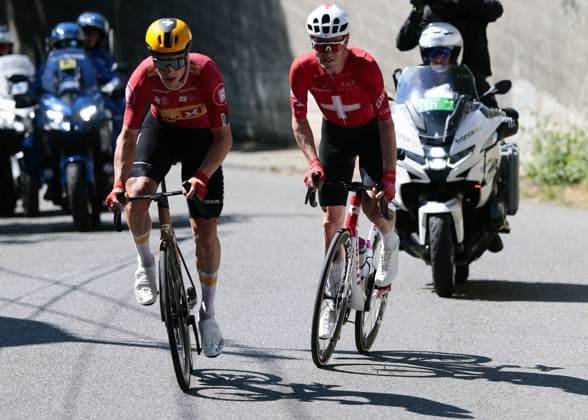 Norwegian Jonas Abrahamsen of Uno-X Mobility and Swiss Mauro Schmid of Team Jayco AIUIa pictured in action stage 11 of the 2025 Tour de France cycling, from and to Toulouse (154km), on Wednesday 16 July 2025 in France. The 112th edition of the Tour de France starts on Saturday 5 July in Lille, France, and will finish in Paris, France on the 27th of July. POOLxLUCAxBETTINI  x129379113x
