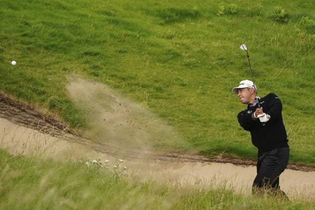 Golf: British Open Hideki Matsuyama of Japan hits out of a bunker on the first hole during the first round of the British Open golf tournament at Royal Portrush Golf Club in Portrush, Northern Ireland, on July 17, 2025.  A14AA0004727499P
