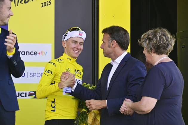 Slovenian Tadej Pogacar of UAE Team Emirates and French President Emmanuel Macron pictured on the podium after stage 12 of the 2025 Tour de France cycling, from Auch to Hautacam (181 km), on Thursday 17 July 2025 in France. The 112th edition of the Tour de France starts on Saturday 5 July in Lille, France, and will finish in Paris, France on the 27th of July. DIRKxWAEM  x129448785x