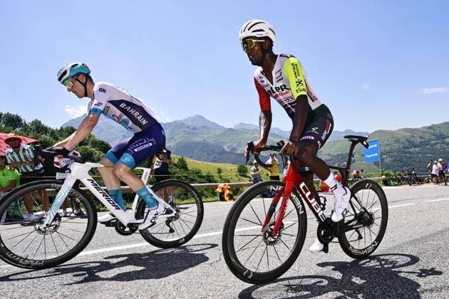 French Aurelien Paret-Peintre of Decathlon AG2R La Mondiale Team and Eritrean Biniam Girmay Hailu of Intermarche-Wanty pictured in action during stage 13 of the 2025 Tour de France cycling race, an 11km individual time trial from Loudenvielle to Peyragudes, on Friday 18 July 2025 in France. The 112th edition of the Tour de France starts on Saturday 5 July in Lille, France, and will finish in Paris, France on the 27th of July. DIRKxWAEM  x129490133x