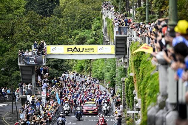 The peloton pictured underneath the Pau banner at the start of stage 14 of the 2025 Tour de France cycling race, from Pau to Luchon-Superbagneres (183 km), on Saturday 19 July 2025 in France. The 112th edition of the Tour de France starts on Saturday 5 July in Lille, France, and will finish in Paris, France on the 27th of July. JASPERxJACOBS  x129556426x
