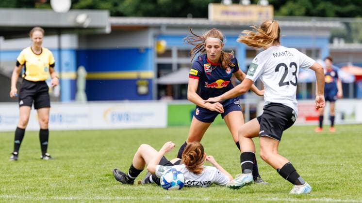 Sara Grabovac 14, FC Red Bull Salzburg , Sophie Marten 23, FFC Wacker München , lying on the ground Lisa Flötzner 13, FFC Wacker München during the match FFC Wacker München v FC Red Bull Salzburg, Soccer, Women, Regionalliga Süd, 2025 2026, Test match on 19 07 2025 in Fürstenfeldbruck, Stadion a d Klosterstraße Bayern Germany