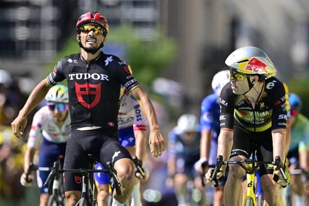 French Julian Alaphilippe of Tudor Pro Cycling Team, Belgian Wout van Aert of Team Visma-Lease a Bike and pictured crossing the finish line of the stage 15 of the 2025 Tour de France cycling race, from Muret to Carcasonne (169 km), on Sunday 20 July 2025 in France. The 112th edition of the Tour de France starts on Saturday 5 July in Lille, France, and will finish in Paris, France on the 27th of July. DIRKxWAEM  x129658593x