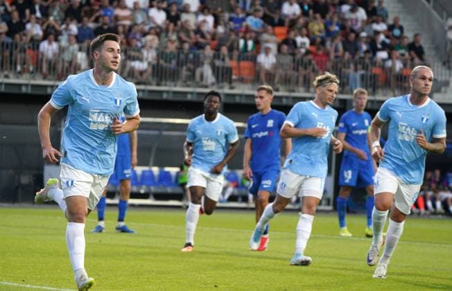 UEFA, UEFA Champions League, Champions League qualifying, soccer, football, RFS, Malmo FF Lasse Berg Johnsen, left, celebrates with teammates during their UEFA Champions League second qualifying round first leg soccer match between Latvia™s RFS and Sweden™s Malmo FF in Riga, Latvia, 22.07.2025. Riga Latvia Copyright: xRomanxKoksarovx RKO09006.JPG