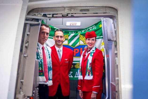 SOCCER - UEFA ECL, Decic vs Rapid SCHWECHAT,AUSTRIA,23.JUL.25 - SOCCER - UEFA Europa Conference League, qualification, FK Decic Tuzi vs SK Rapid Wien, preview, departure Rapid. Image shows the Austrian Airlines Crew wearing SK Rapid Wien merchandise.  GEPAxpictures xKevinxHackner