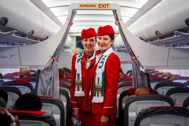 SOCCER - UEFA ECL, Decic vs Rapid SCHWECHAT,AUSTRIA,23.JUL.25 - SOCCER - UEFA Europa Conference League, qualification, FK Decic Tuzi vs SK Rapid Wien, preview, departure Rapid. Image shows the Austrian Airlines Crew wearing SK Rapid Wien merchandise.  GEPAxpictures xKevinxHackner