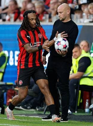 Kevin Mbabu of FC Midtjylland takes the ball from Hibernian manager David Gray Midtjylland v Hibernian, UEFA Europa League, 2nd Qualifying Round, First Leg, Football, MCH Arena, Herning, Denmark - 24 Jul 2025Herning MCH Arena Denmark EDITORIAL USE ONLY No use with unauthorised audio, video, data, fixture lists, club league logos or live services. Online in-match use limited to 120 images, no video emulation. No use in betting, games or single club league player publications. Copyright: xJohnnyxPedersen Shutterstockx 15410838ai